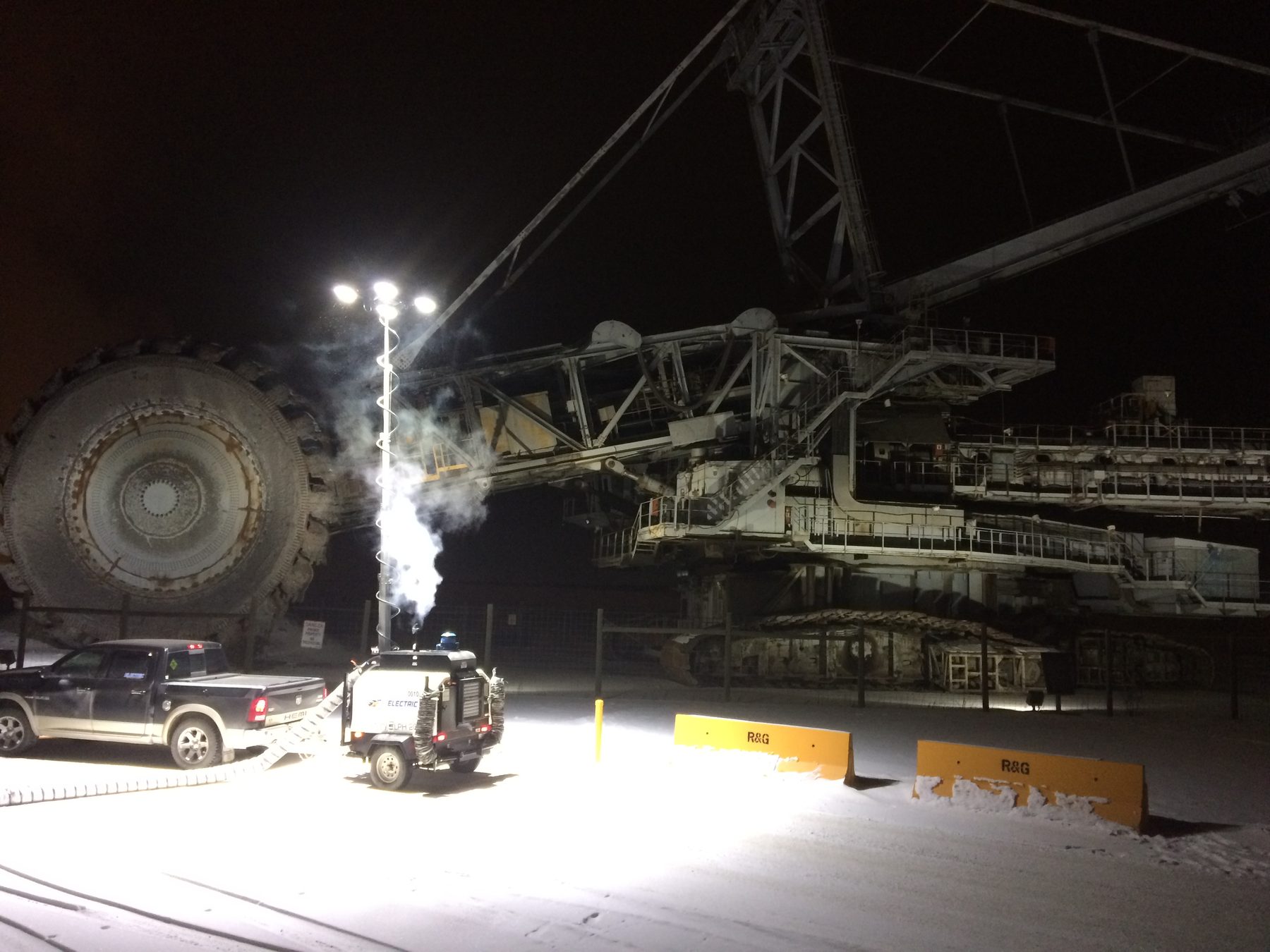 A walking dragline at the Diplomat Mine at night, lit by floodlights